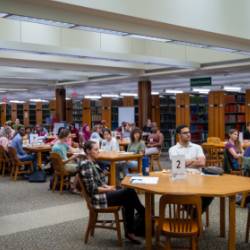 Students gathered around tables in Moon Library