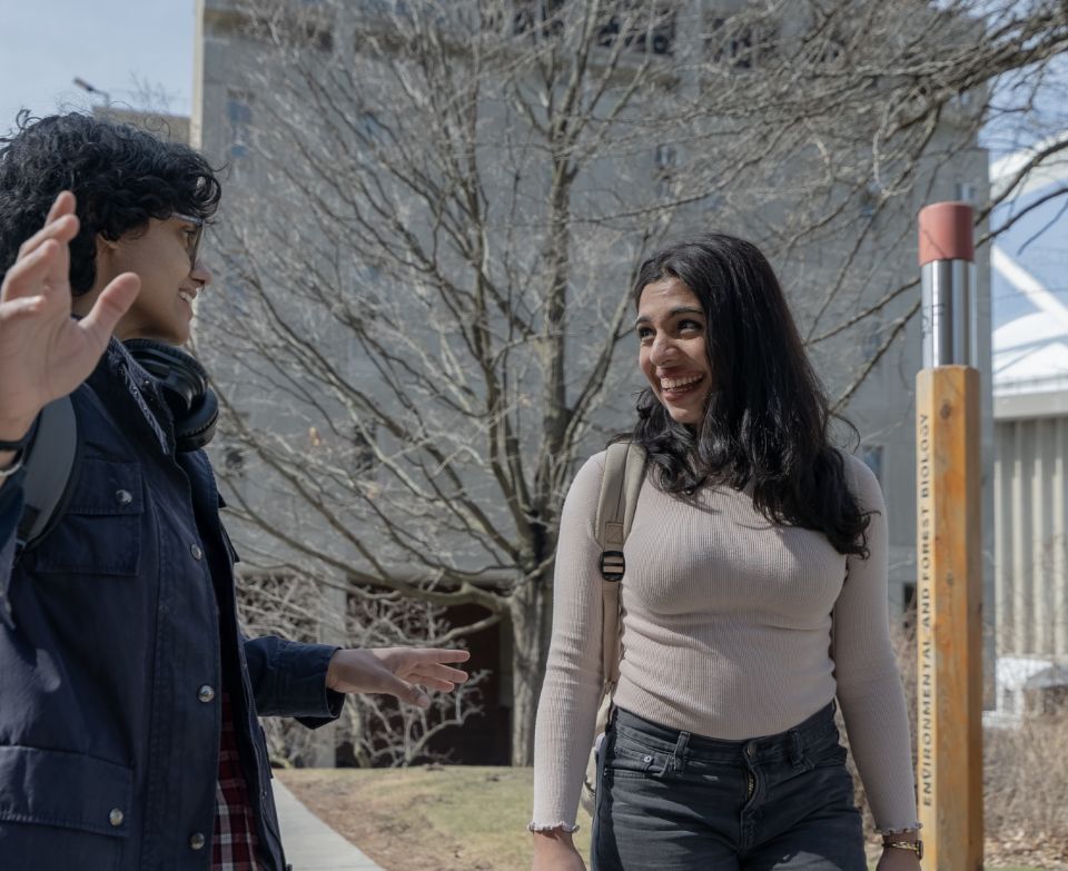 Students walking outside of Bray Hall.