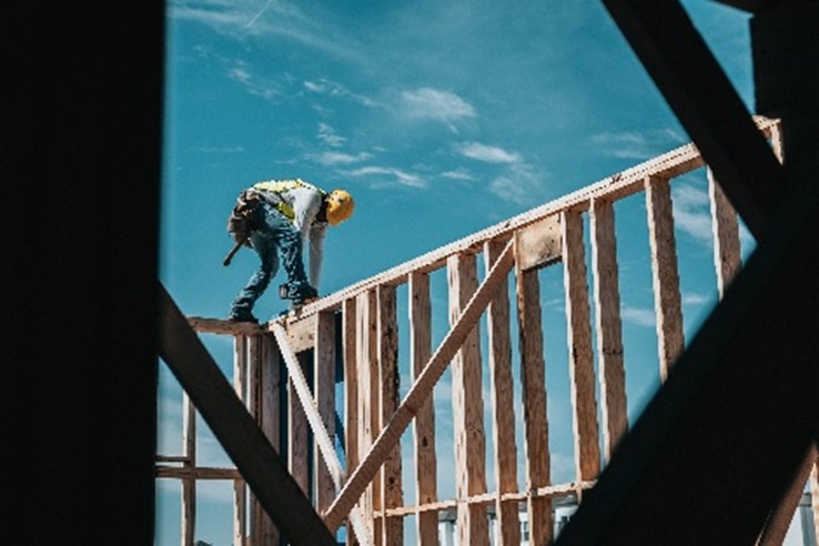 a man walking up on wooden frames