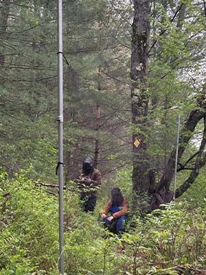 Artie and Chris in full bug and rain gear