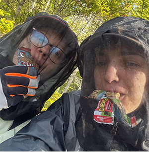 Researchers in Forsayth's bog in bug gear