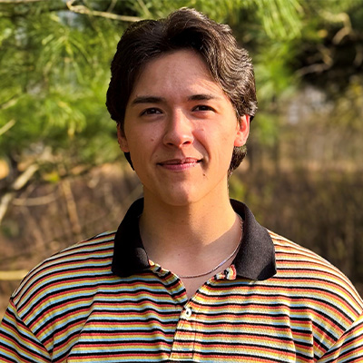 Eliotte Chemberline wearing a striped polo shirt