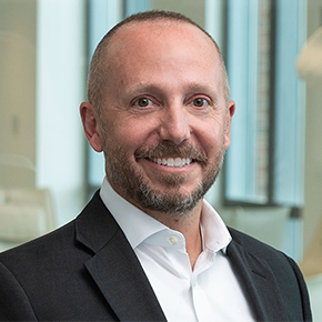 Headshot of Basil Seggos, white male in suit and tie from the shoulders up, looking at camera