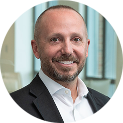 Headshot of Basil Seggos, white male in a suit and tie from the shoulders up looking at camera