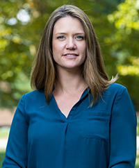 headshot of Rachel Nicely. She is wearing a blue top.