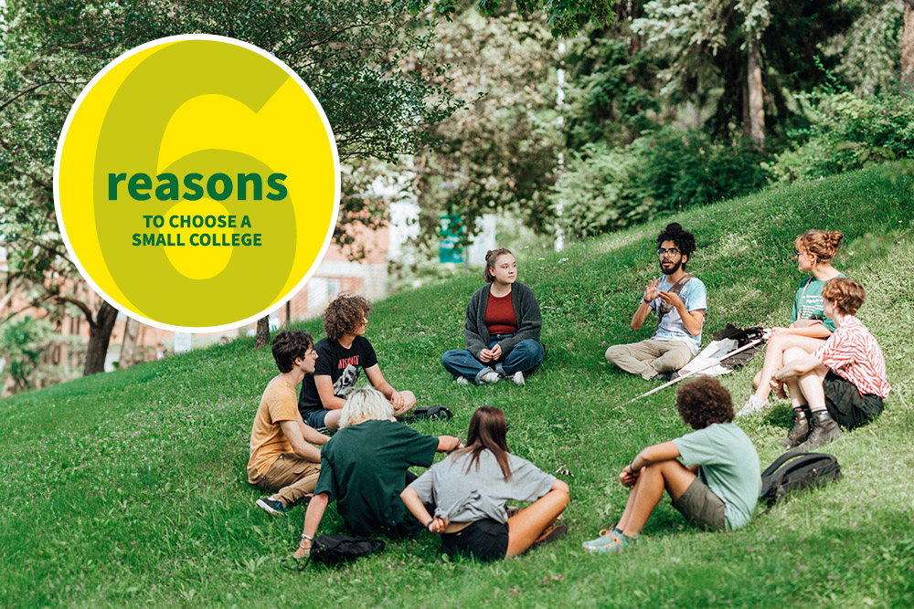 Students sitting outside with an Orientation Leader in a circle on grass